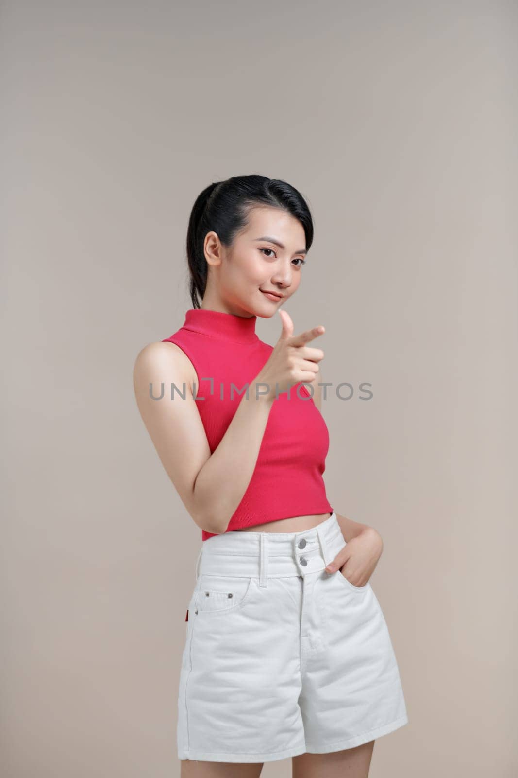 Young beautiful girl smiling happy pointing with hand and finger to the side