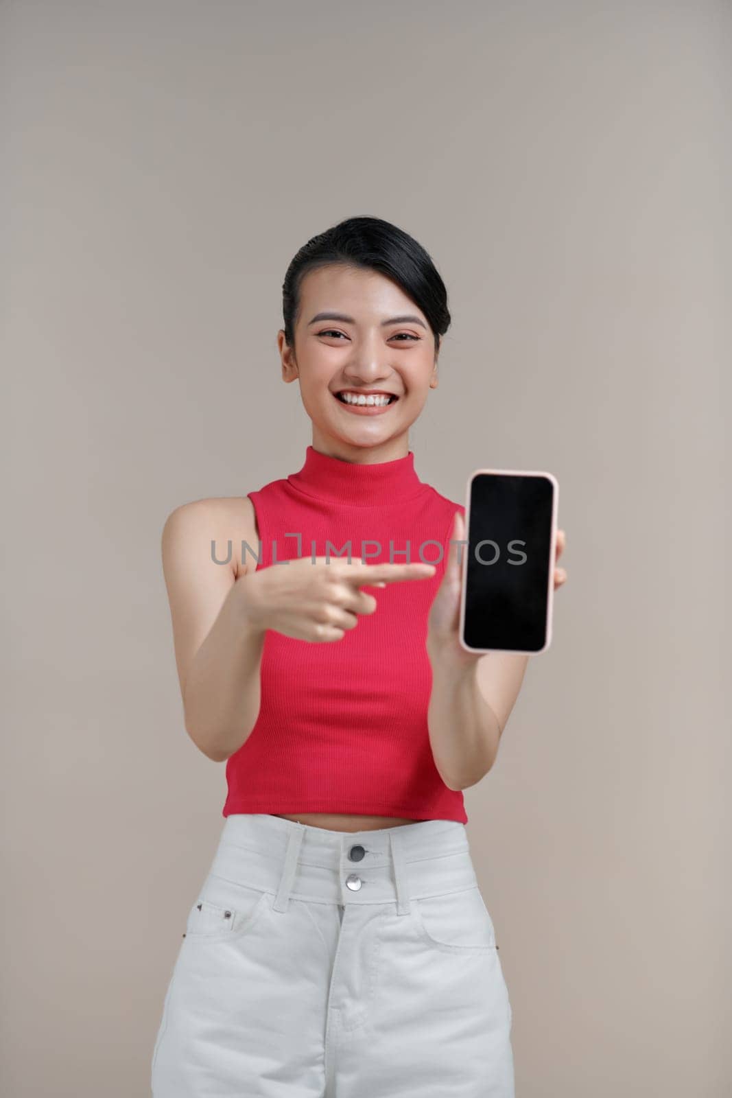 Pretty millennial asian girl text messaging on cell phone or using smartphone with wireless connection by makidotvn