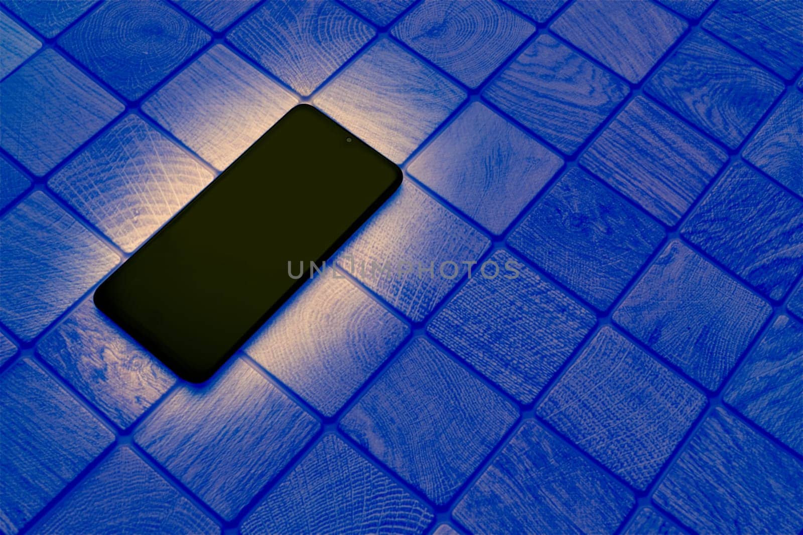 Glowing black mobile phone on a checkered tiled dark blue surface by jovani68