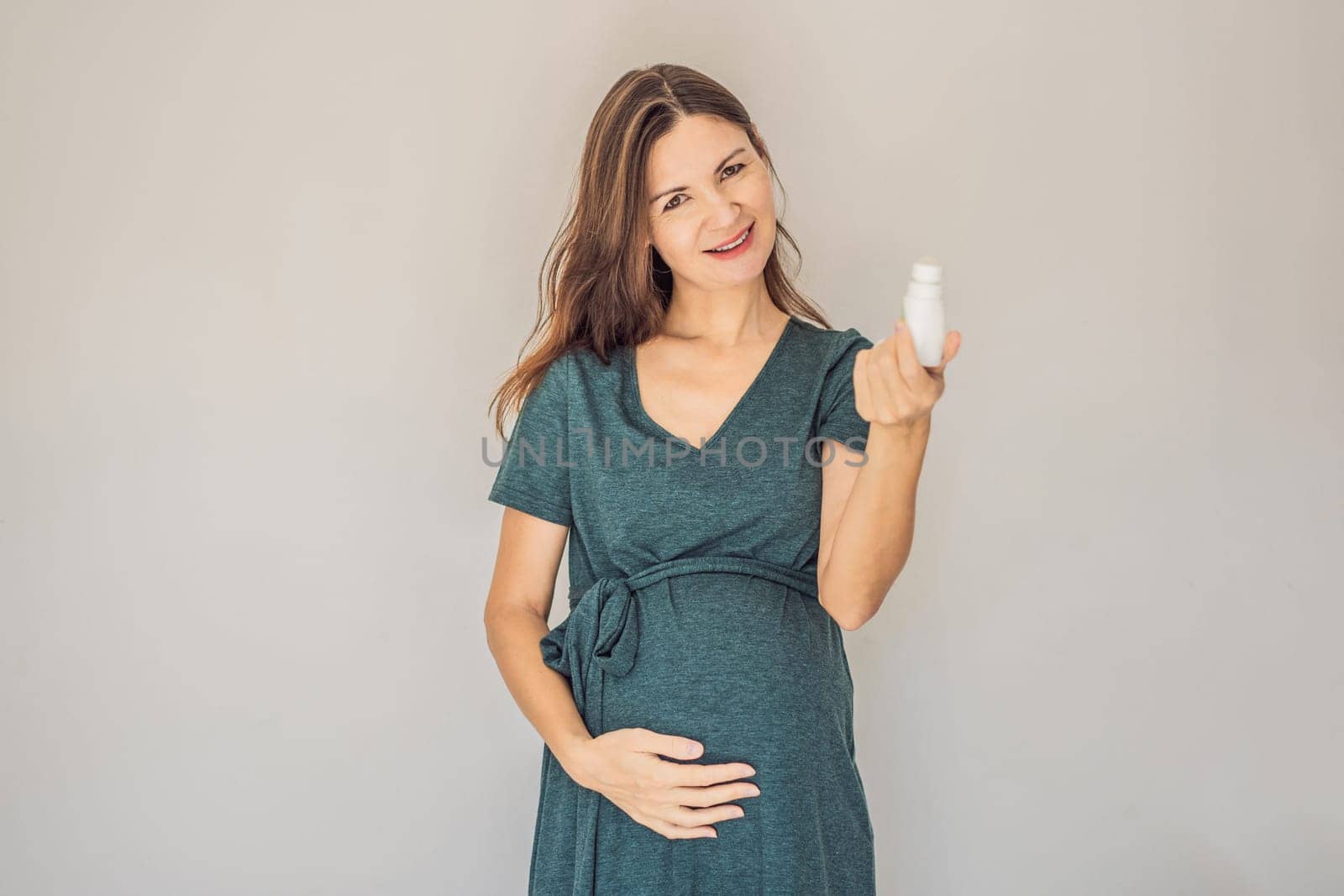 Confident and radiant pregnant woman over 40 showcasing the debate on pregnancy and deodorant. Is it good or bad for expectant mothers. Embrace the journey with safe and gentle options.