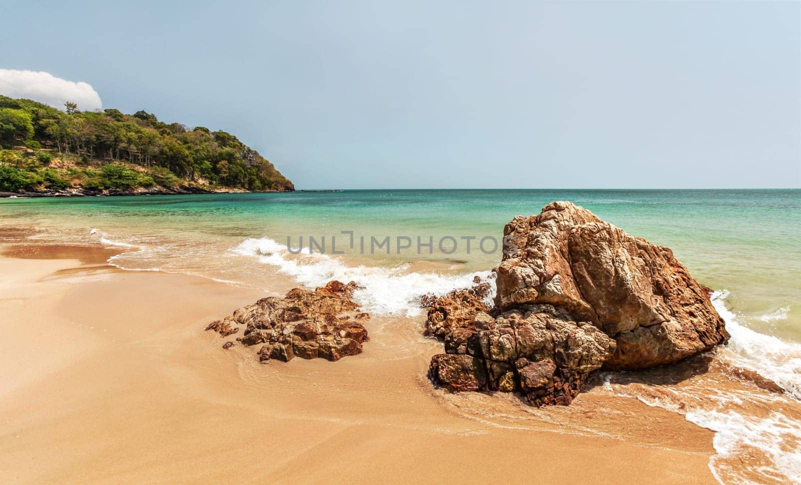 Beautiful unspoiled beach with two rocks in foreground. Klong Nin, Koh Lanta, Thailand