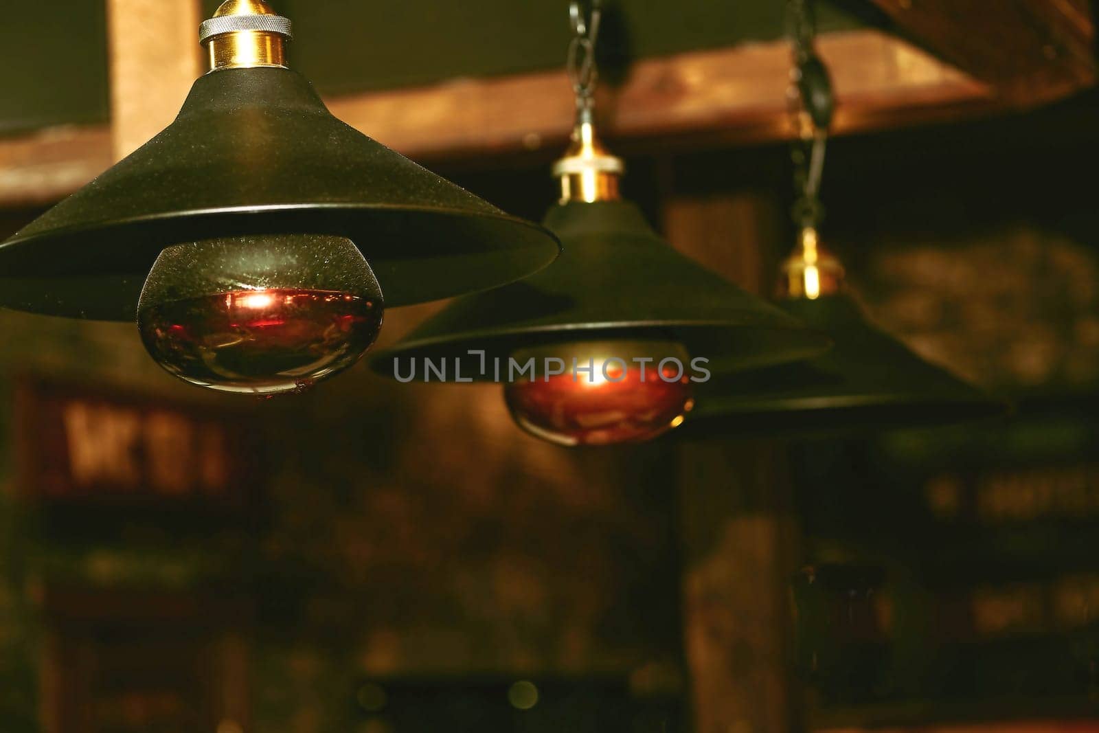 Warm electric incandescent lamp close up in a wooden house by jovani68