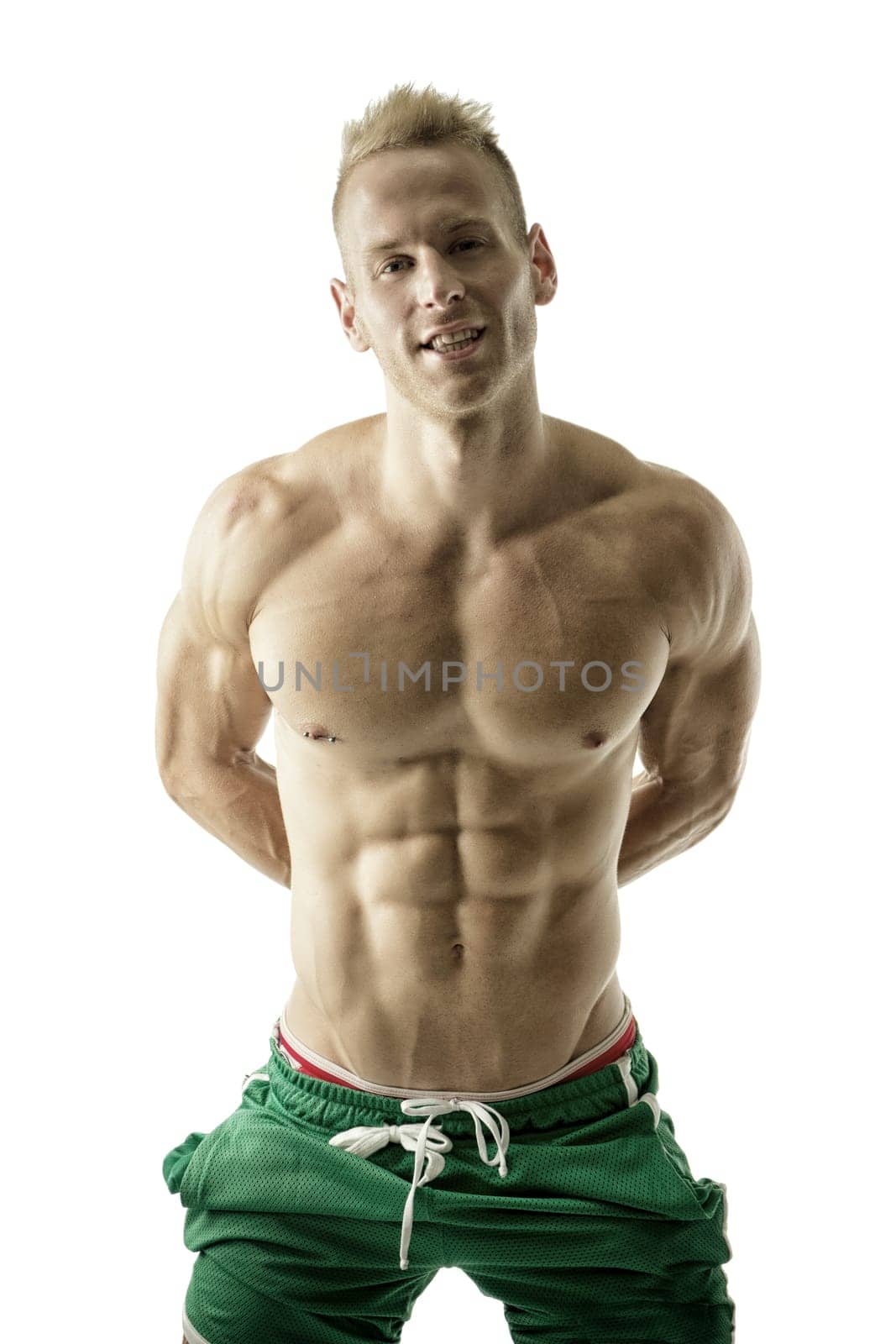 A man in green shorts posing for a picture