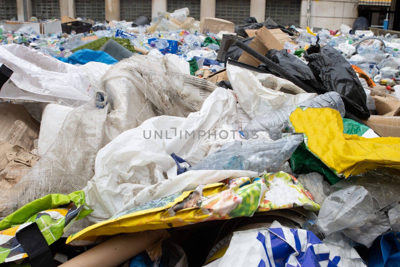 Various recyclable plastic garbage in a landfill. Mid shot