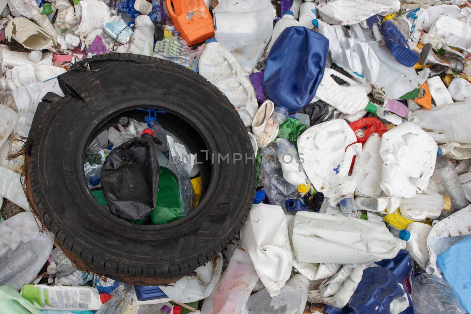 Rubber tire and plastic garbage in a landfill - a problem of environmental pollution by Studia72