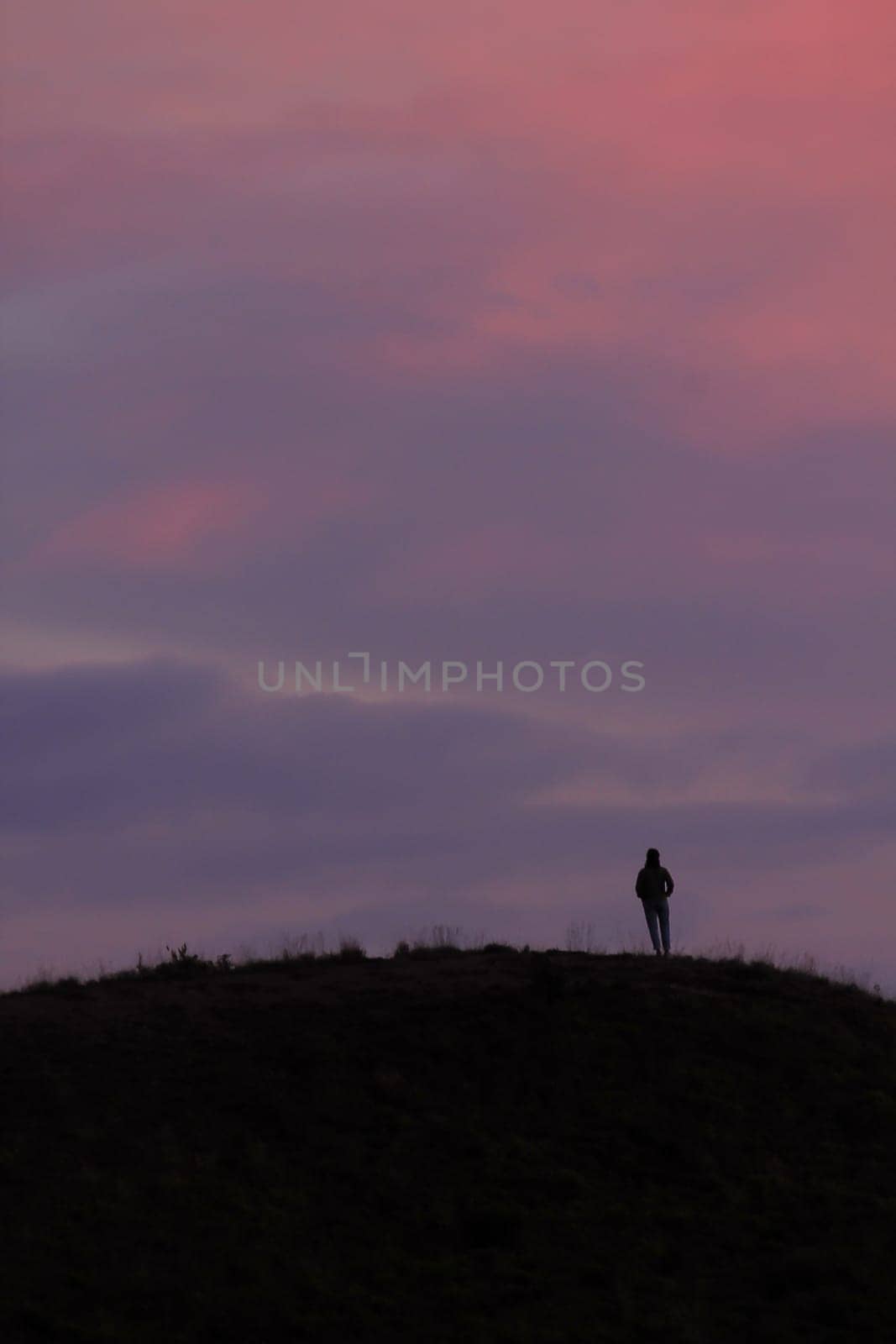 Silhouettes of people standing on the summit. by Puripatt
