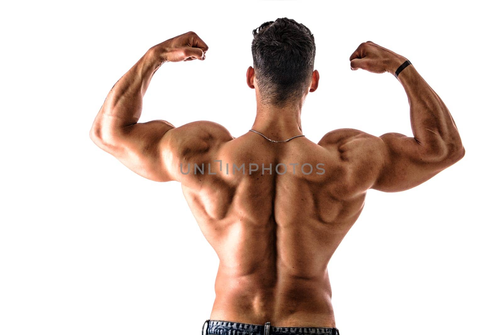 A man flexing his muscles in front of a white background