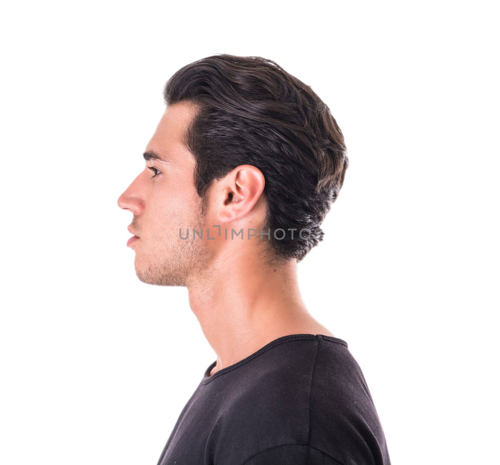 A man in a black shirt looking off to the side