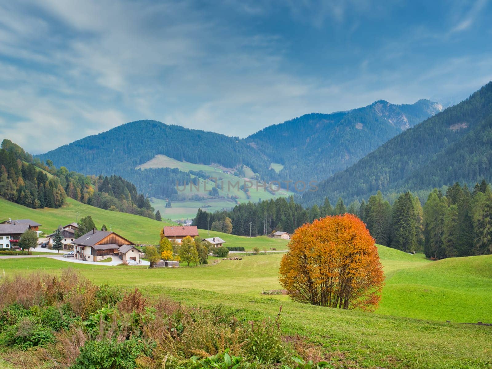 Photo of a quaint wooden shelter nestled in the picturesque Dolomite Alps of Italy by artofphoto