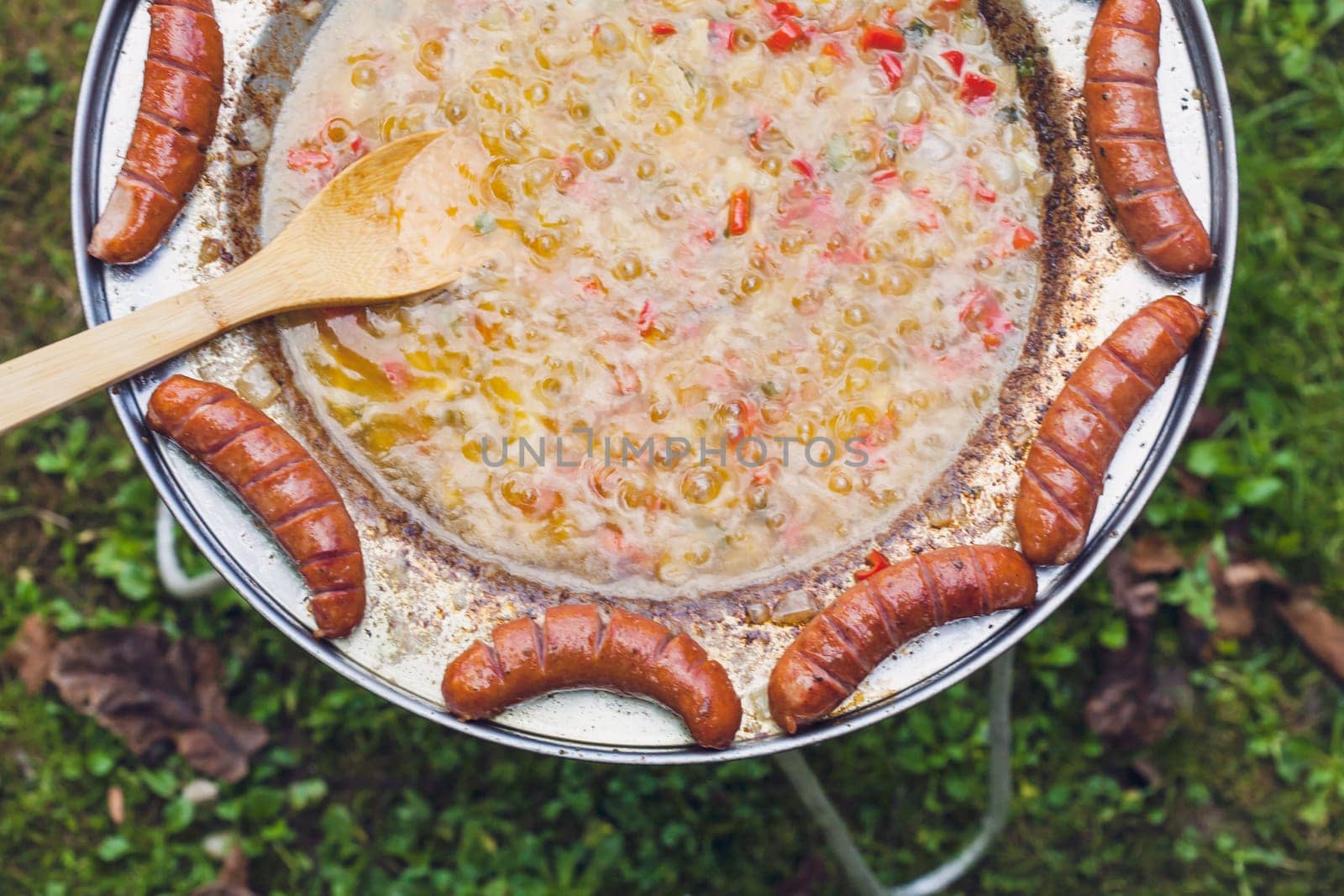 Baked sausages in traditional Croatian dish kotlovina.