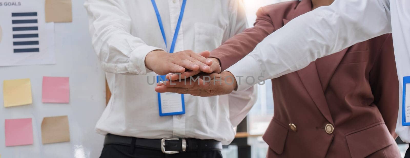 Businessmen working together to start a new project in work by wichayada