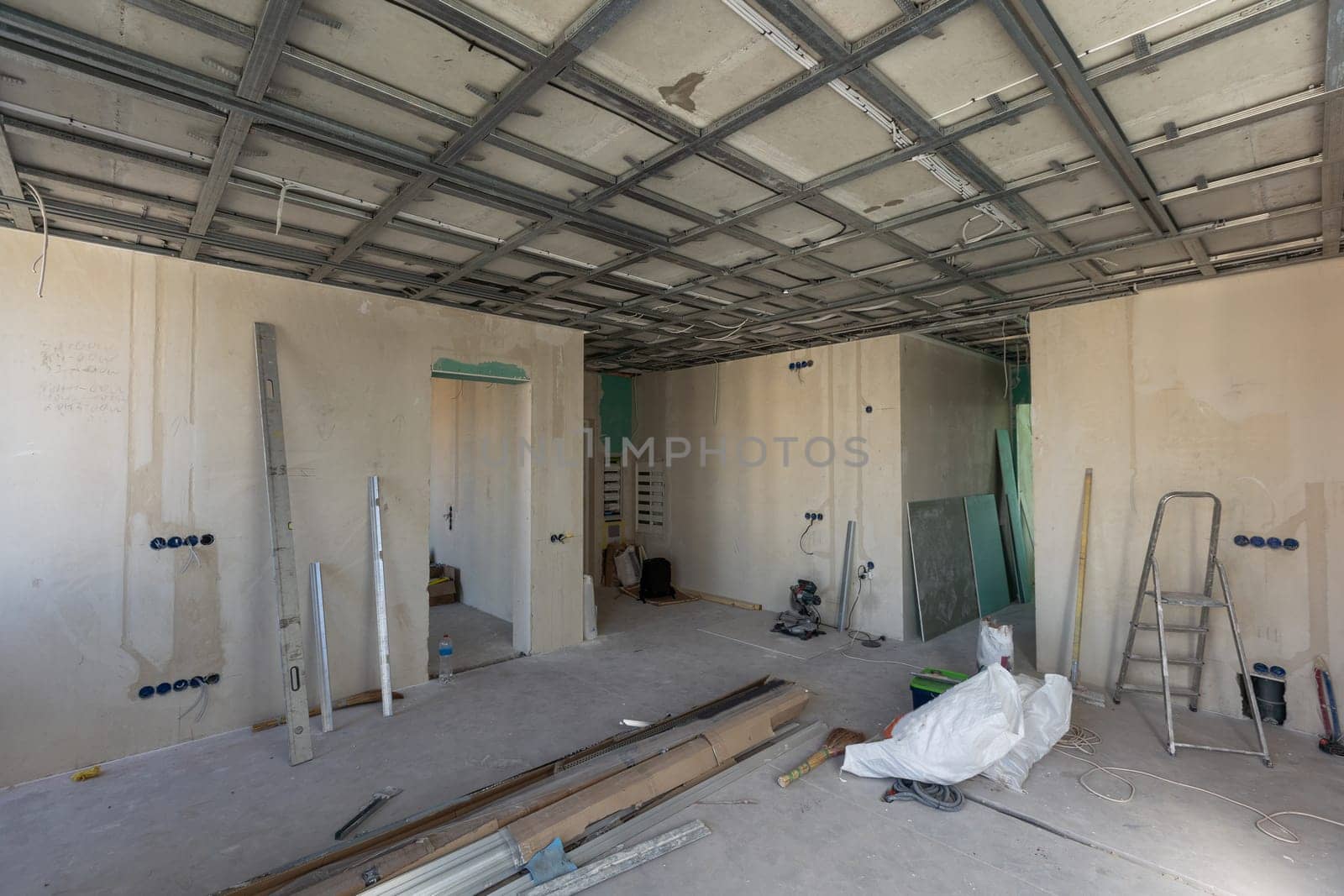 Empty under construction room in home or house with space on site. Interior. Old unfurnished room rental property, living space units. lifestyle. Renovation. High quality photo