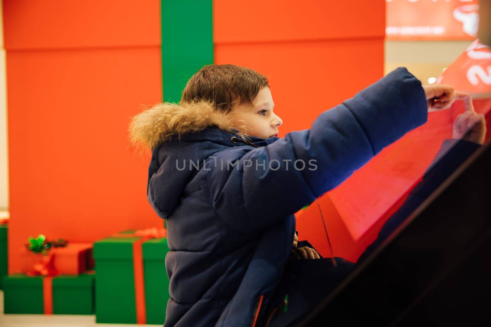 boy using interaction information panel in city