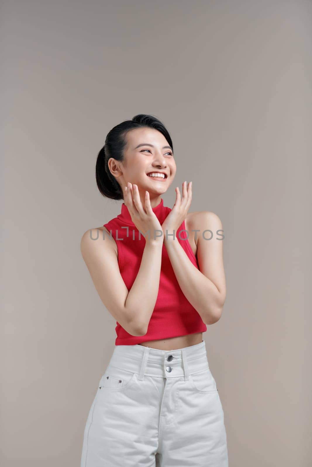 Excited happy young Indian woman expressing shock, with hands gestures,