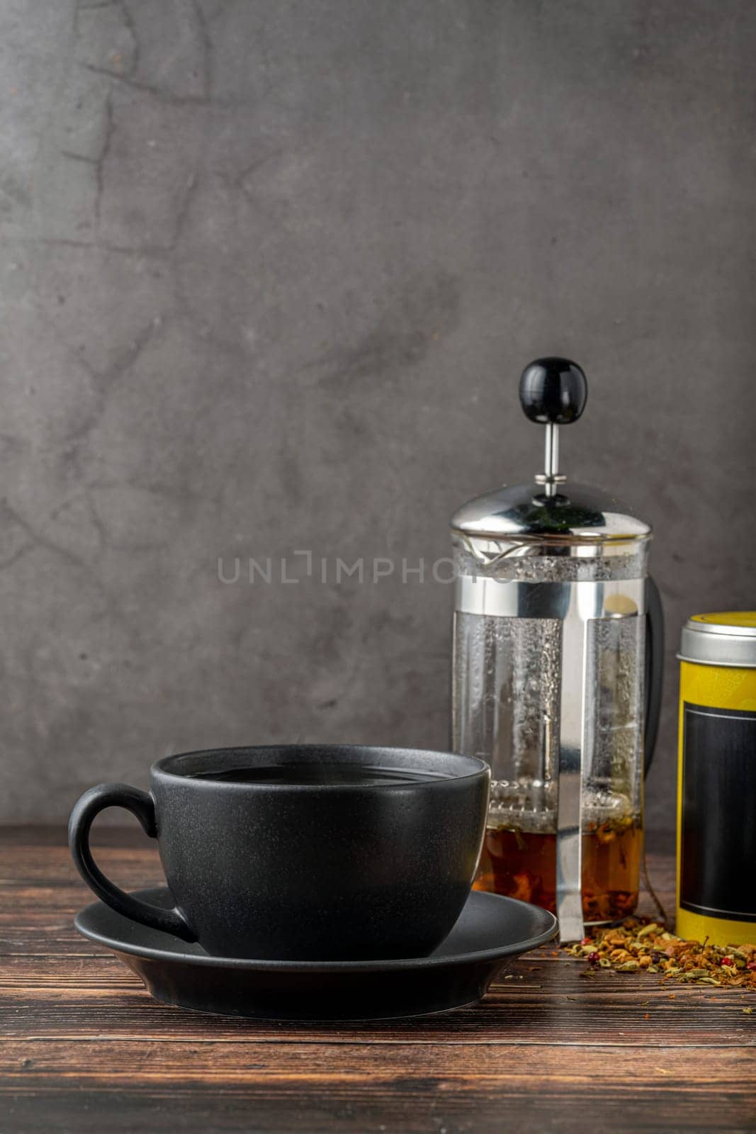 Freshly brewed hot winter tea on a wooden table by Sonat