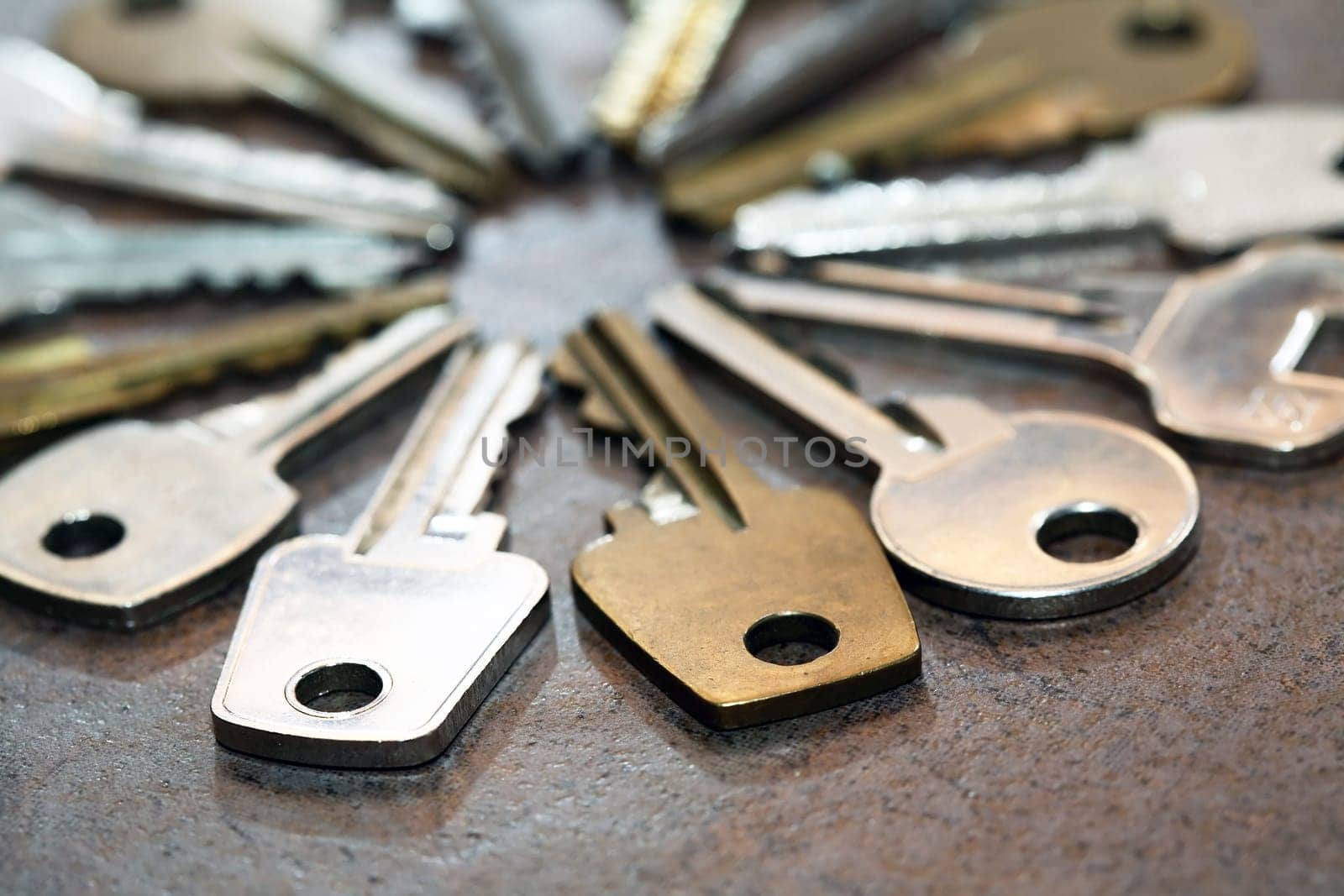 Set of various old keys closeup on rough surface