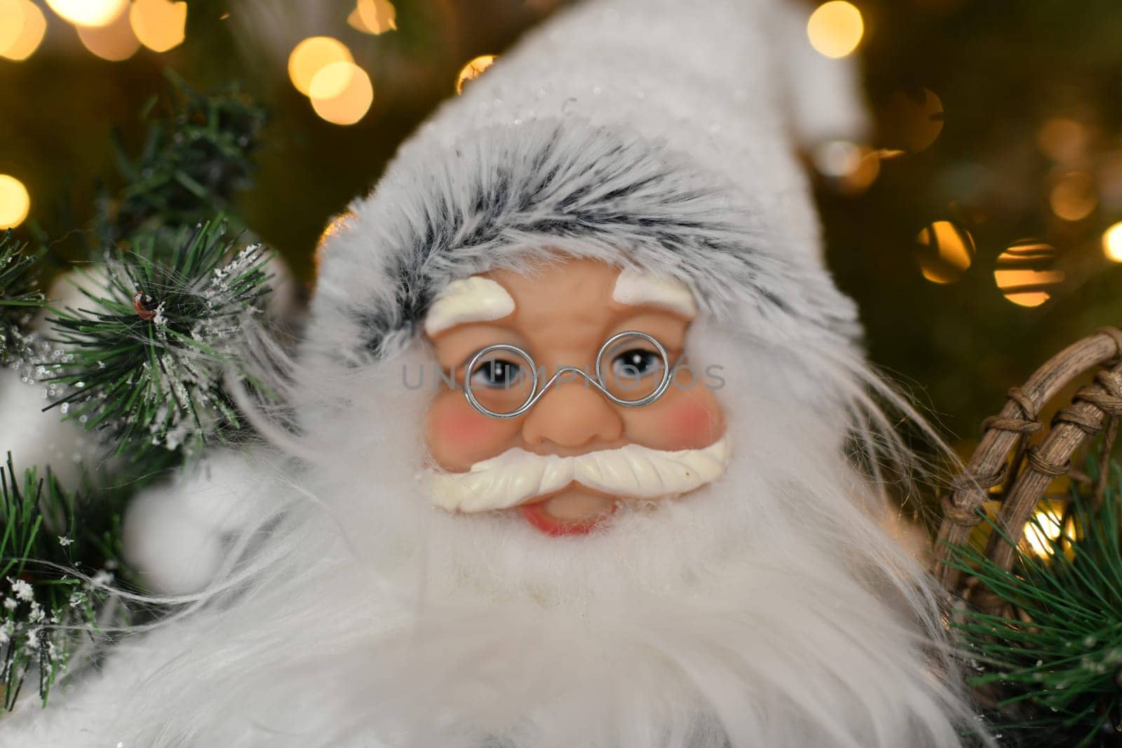 Christmas decorations Santa Claus standing under the Christmas tree