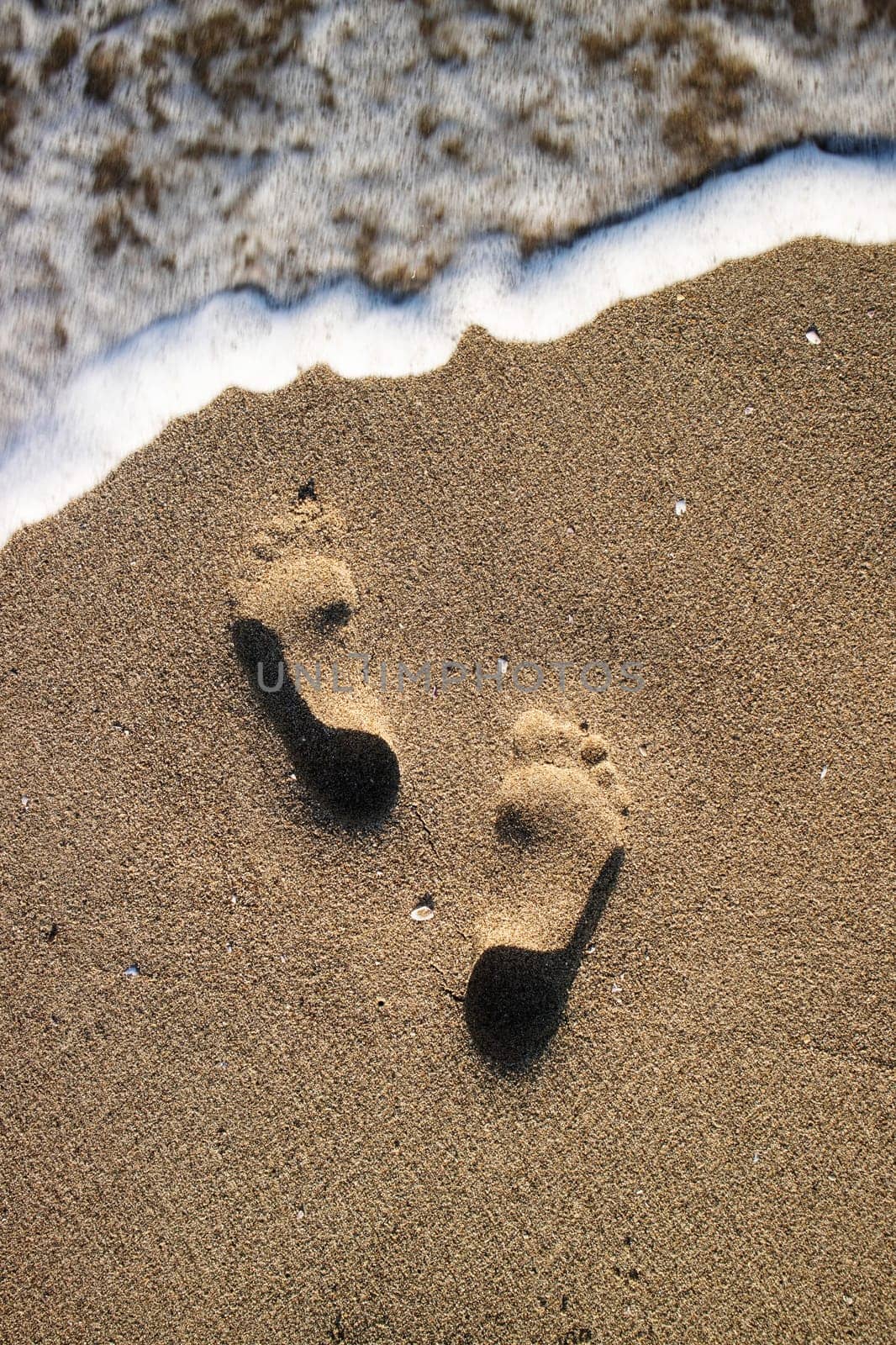 Photographic documentation human footprints in the sand  by fotografiche.eu