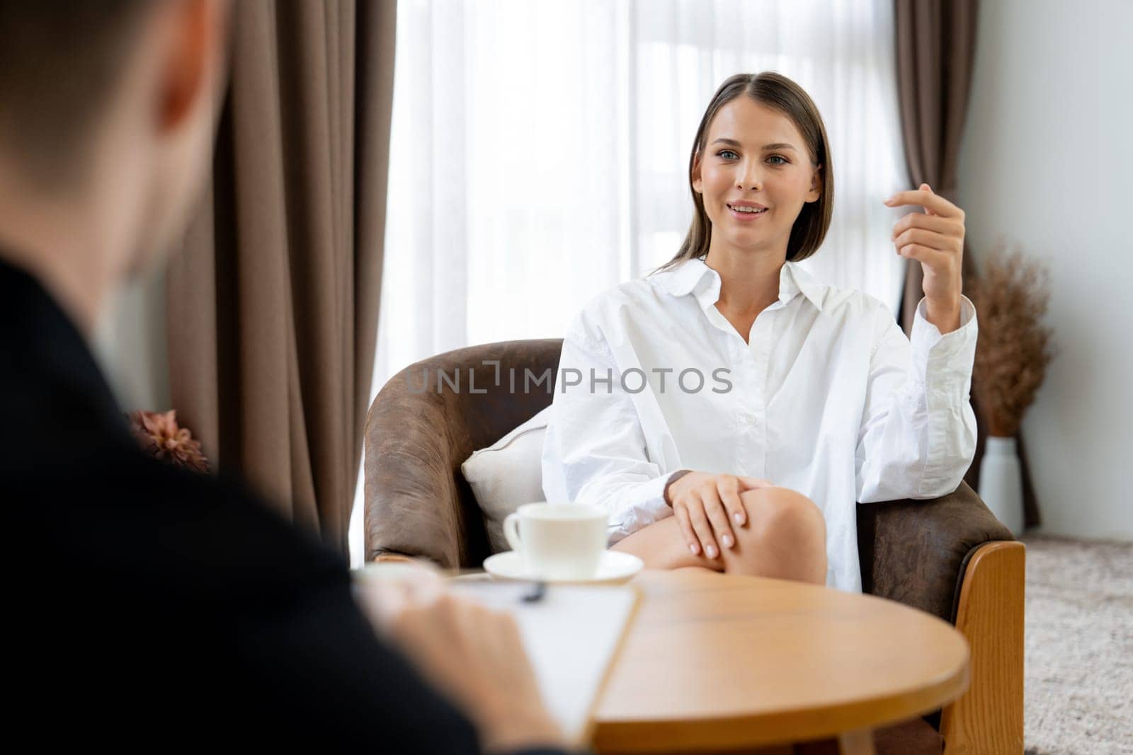 Psychological consultation gaining improvement on mental problem, happy young female patient doing therapy session while psychiatrist making diagnostic on mental illness. Unveiling