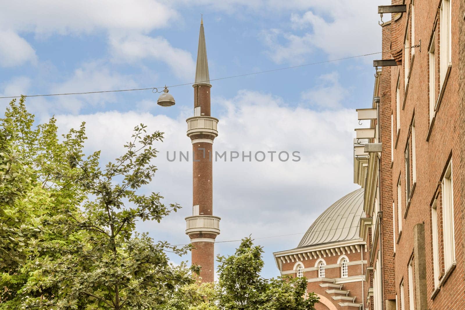 a mosque in the middle of a city street by casamedia