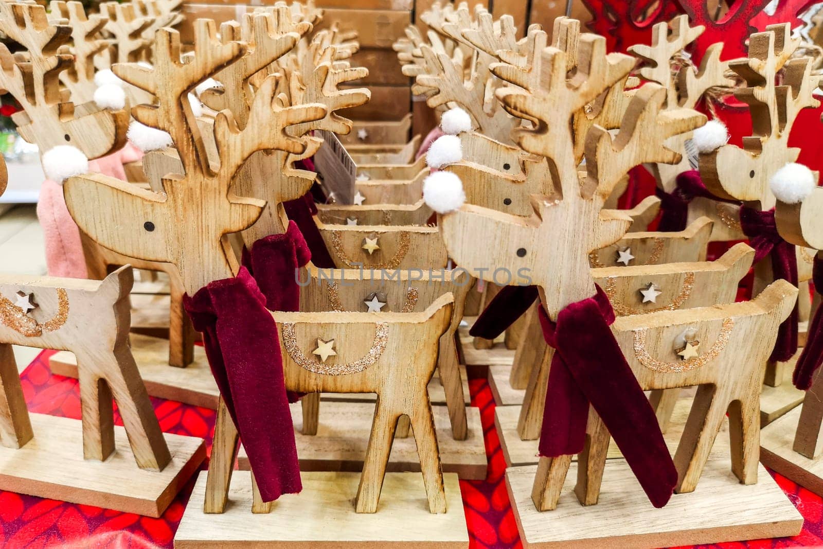 Deer animal toys for sale in a souvenir shop. Traditional wooden toys deer. Christmas wooden animal toys. Christmas market.