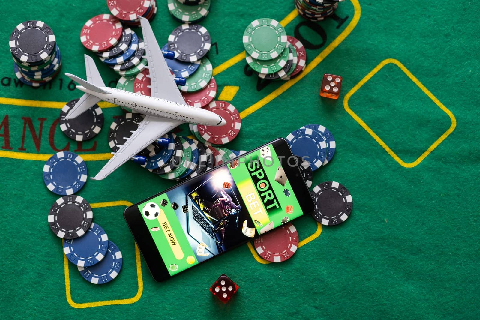 smartphone with betting on sports, casino, toy plane