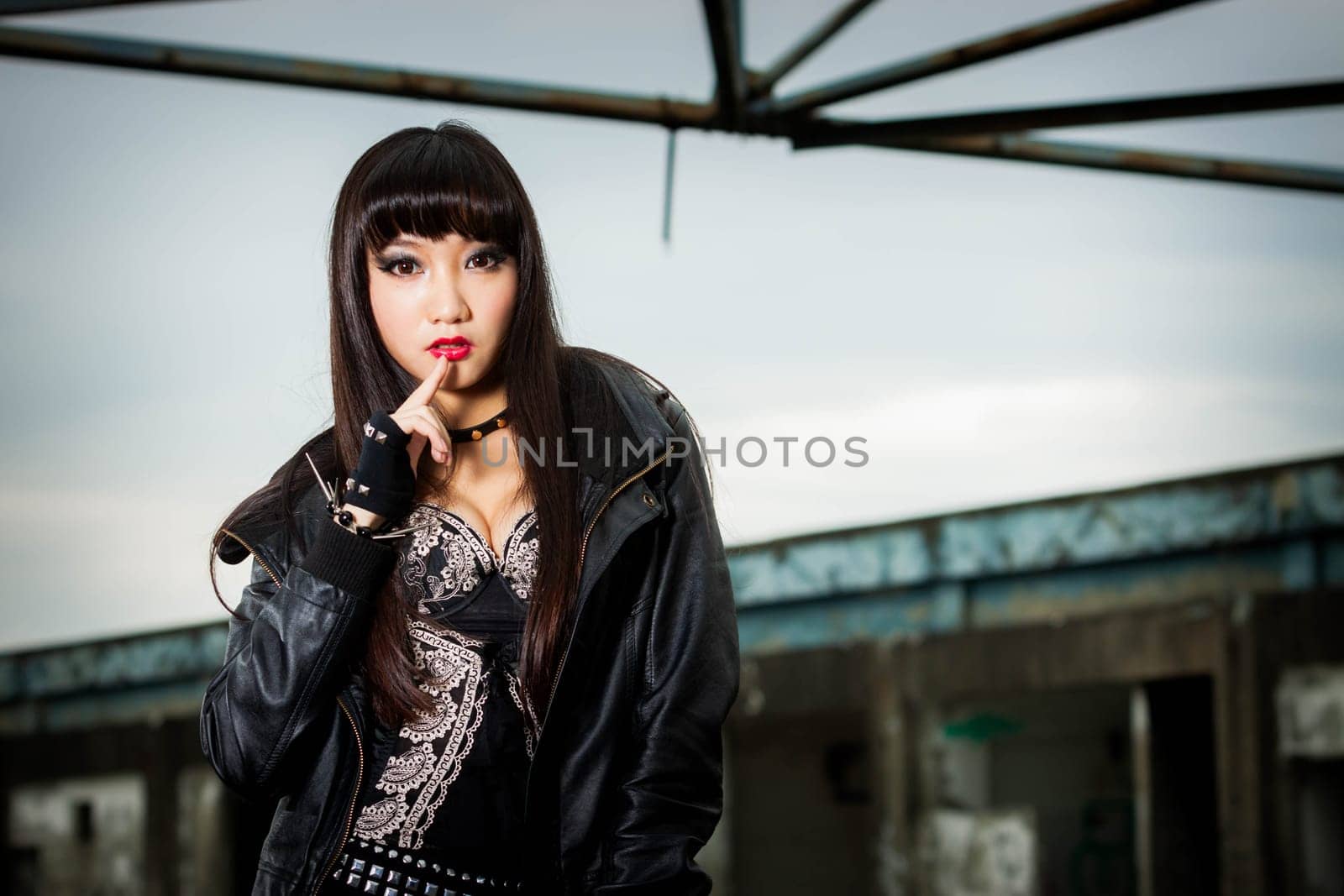 Asian woman in emo goth clothes at an abandoned building by imagesbykenny