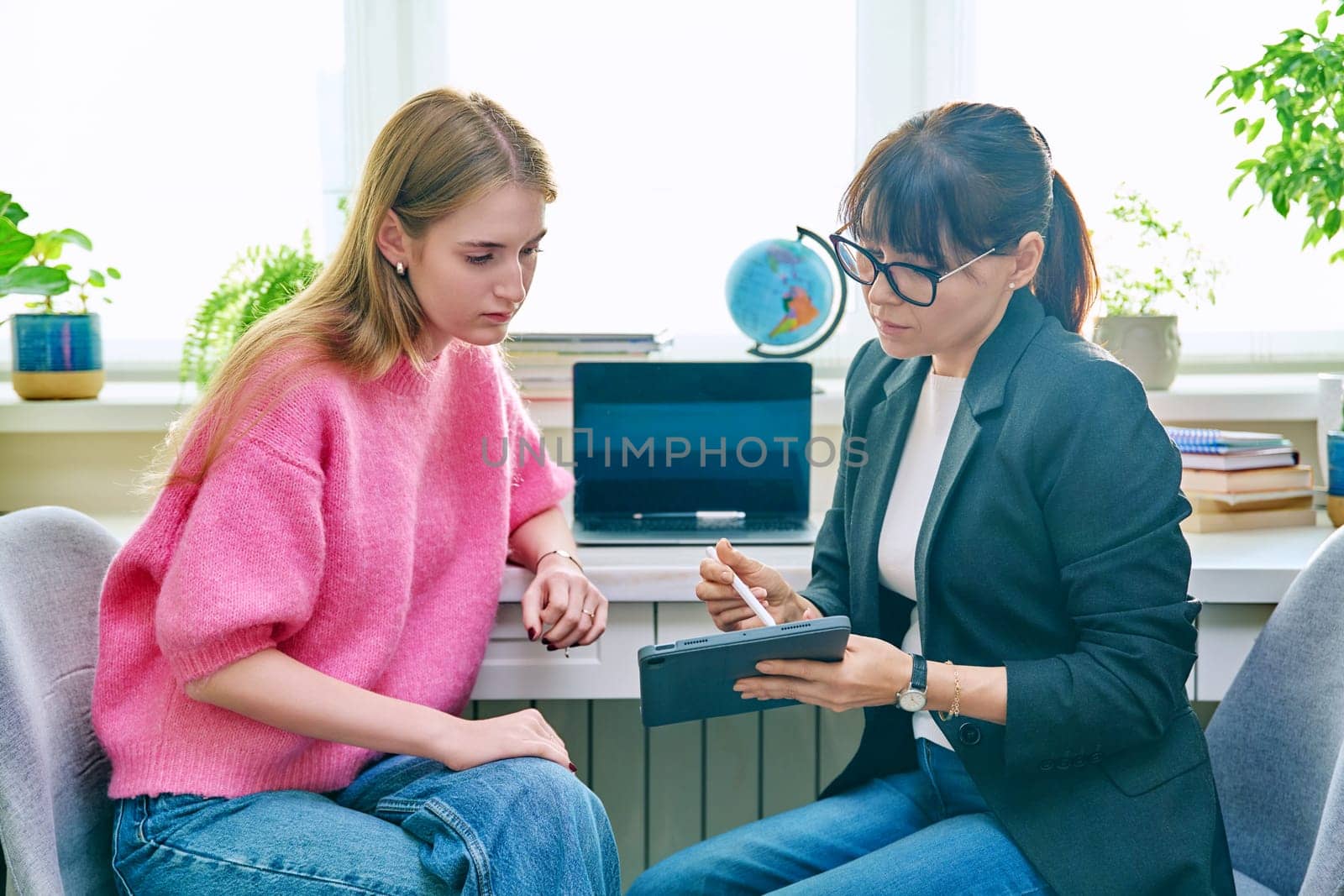 Psychologist, social worker, behavior, counselor talking with teenage girl student, using digital tablet for work. Psychology psychotherapy therapy, adolescence youth, social life, mental health