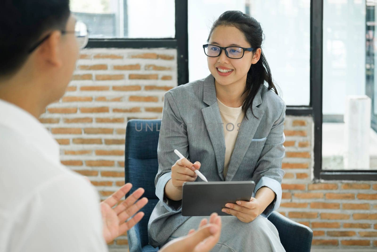 Job Interview, HR manager is interviewing for a job And take job interview notes with a smiley and friendly face to the job applicant. Partnership collaboration, recruitment or lady speaking to hr management for hiring opportunity.