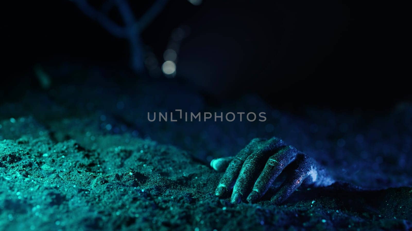 Zombie woman hand crawl in soil on grave. Creepy halloween moment, undead.Cemetery, halloween concept. Living nightmare comes to life. High quality