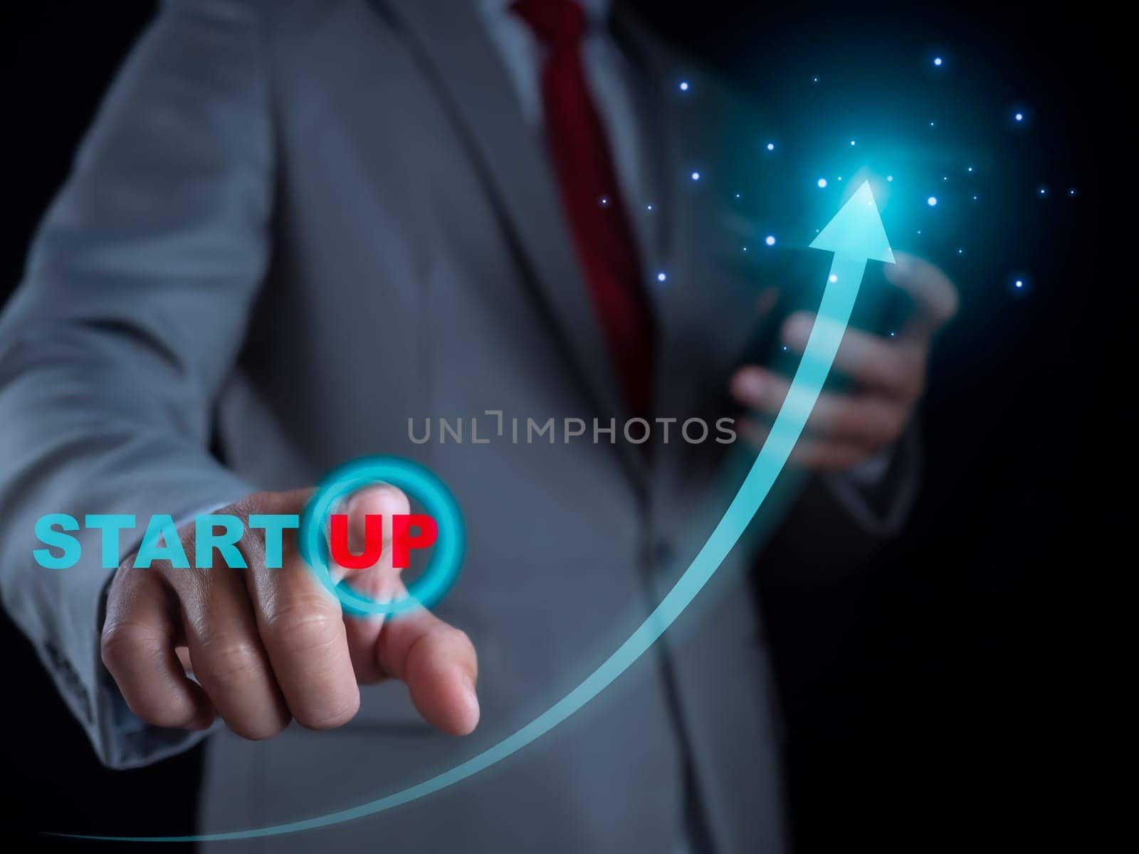Businessman pressing his finger to start a business. Startup concept. Business concept. by Unimages2527