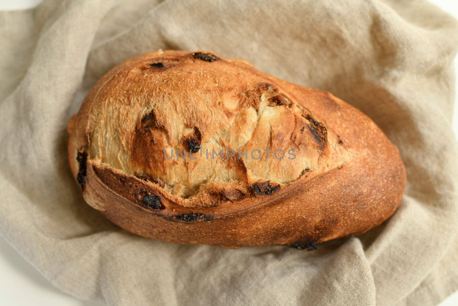 Delicious bread with figs on a beige background
