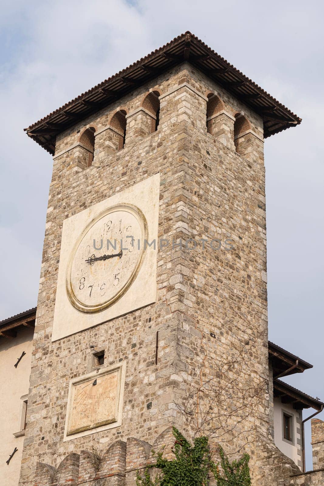 Colloredo di Montealbano, Italy. October 14, 2023the ancient tower with the clock and the sundial of the castle.