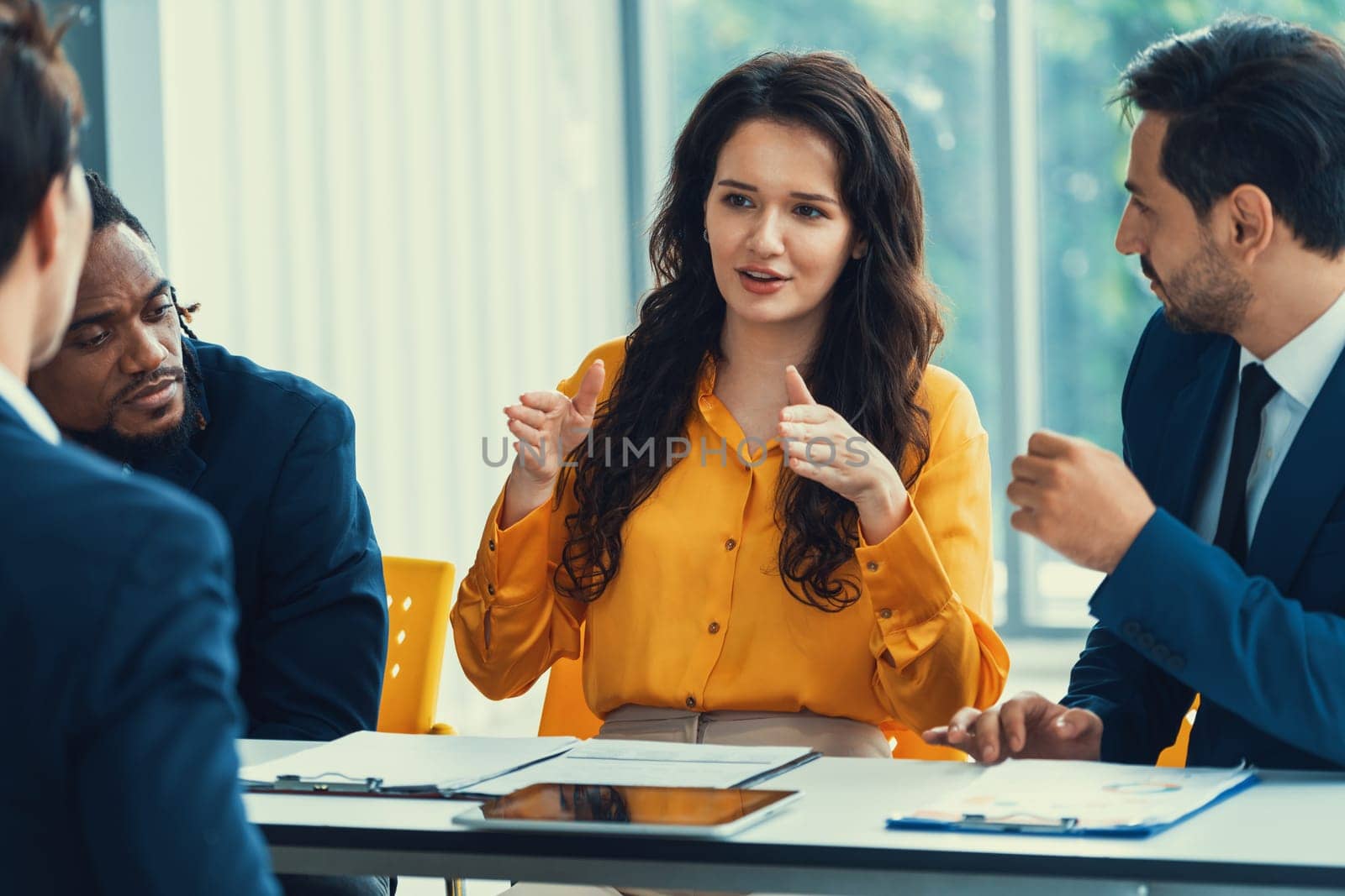 Diversity recruiters interview candidate at the bright office. A group of human resources professionals explaining an applicant for a new position. asking interviewee a question. Intellectual.