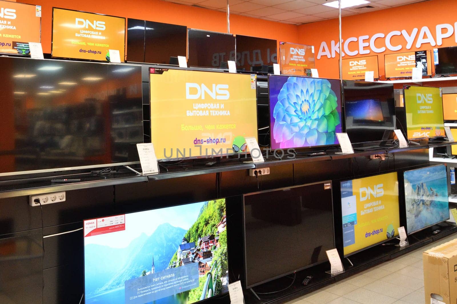 Moscow, Russia - Oct 19. 2023. TVs and and others in DNS network store selling household appliances in Zelenograd by olgavolodina