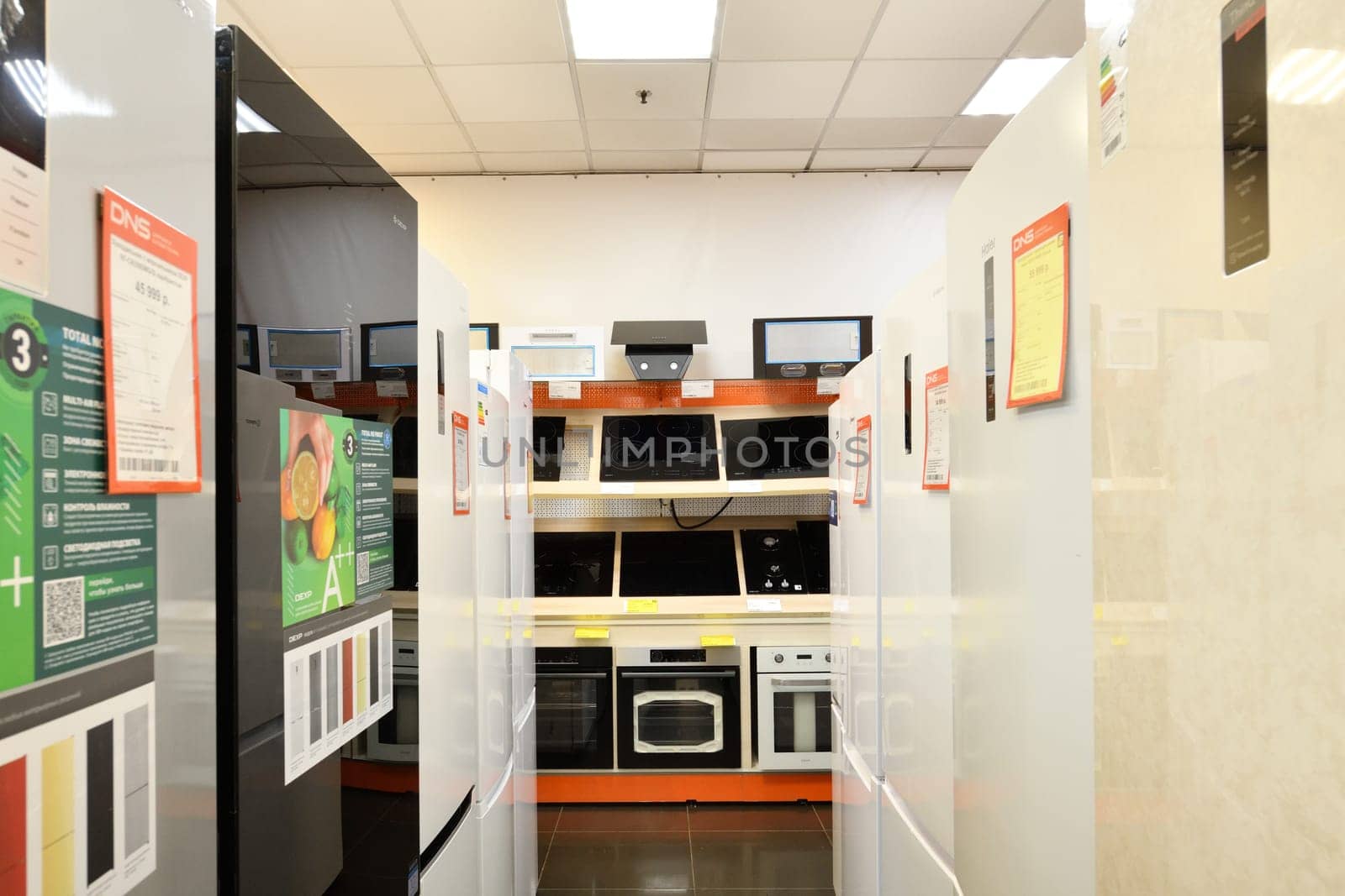 Moscow, Russia - Oct 19. 2023. Electric cooktop and refrigerators in DNS network store selling household appliances in Zelenograd by olgavolodina