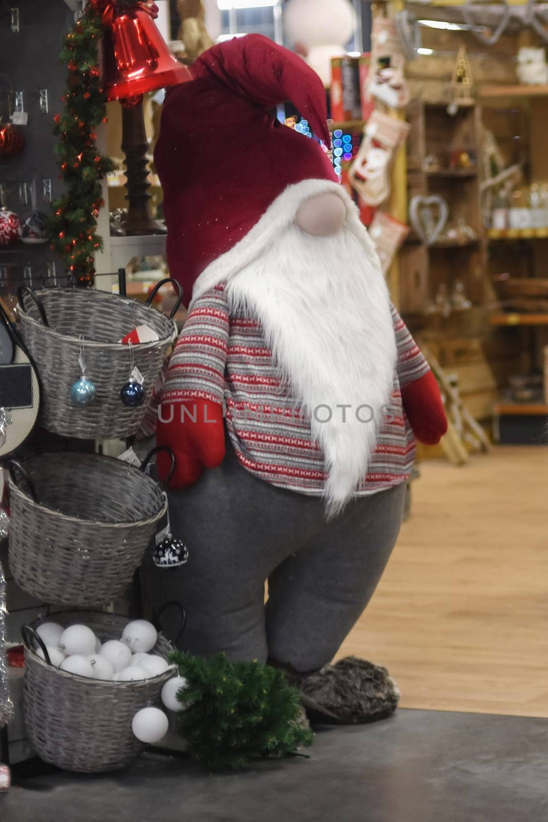 Santa Claus in a store with toys and decorations