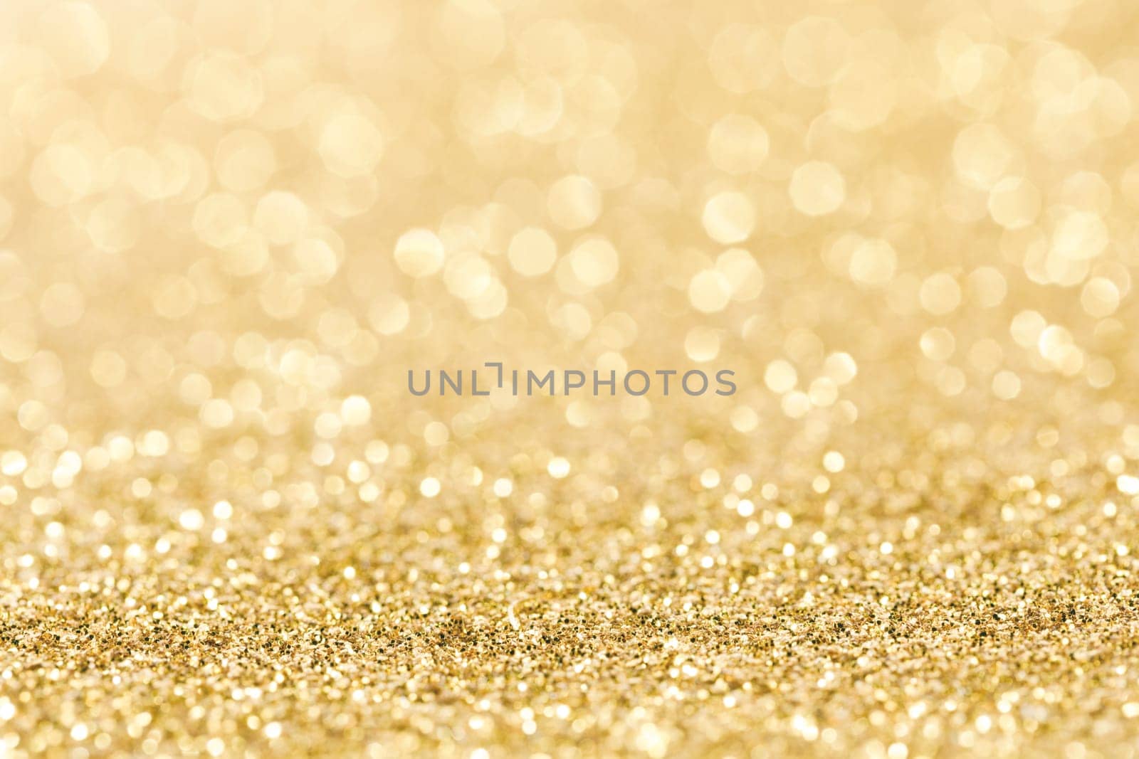 Shiny golden bokeh glitter lights abstract background, Christmas New Year party celebration concept