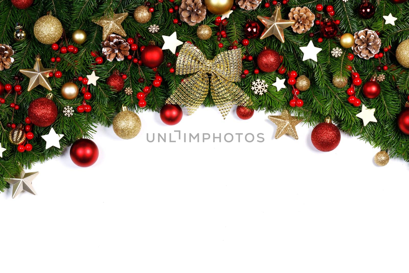 Christmas tree branches and decoration baubles isolated on white background as a border or template for christmas card