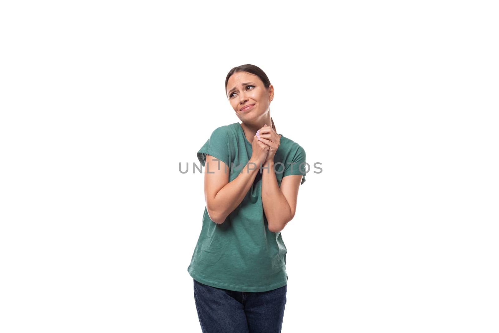 a young woman with black hair and a slender figure dressed in a green T-shirt hopes for good luck by TRMK