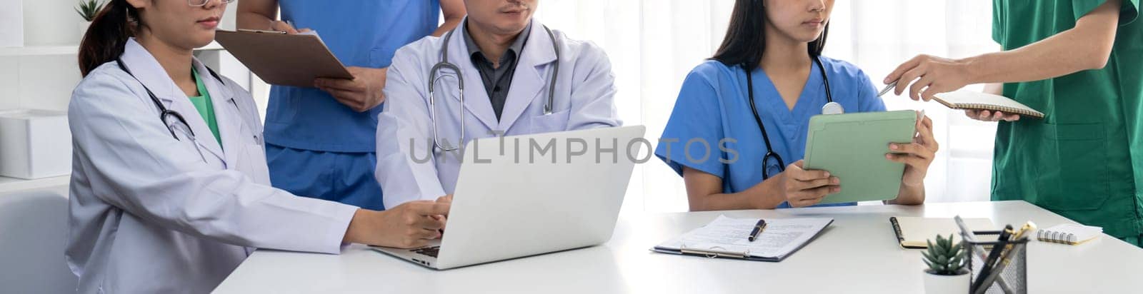 Professional various team of medical working together on the desk. Rigid by biancoblue