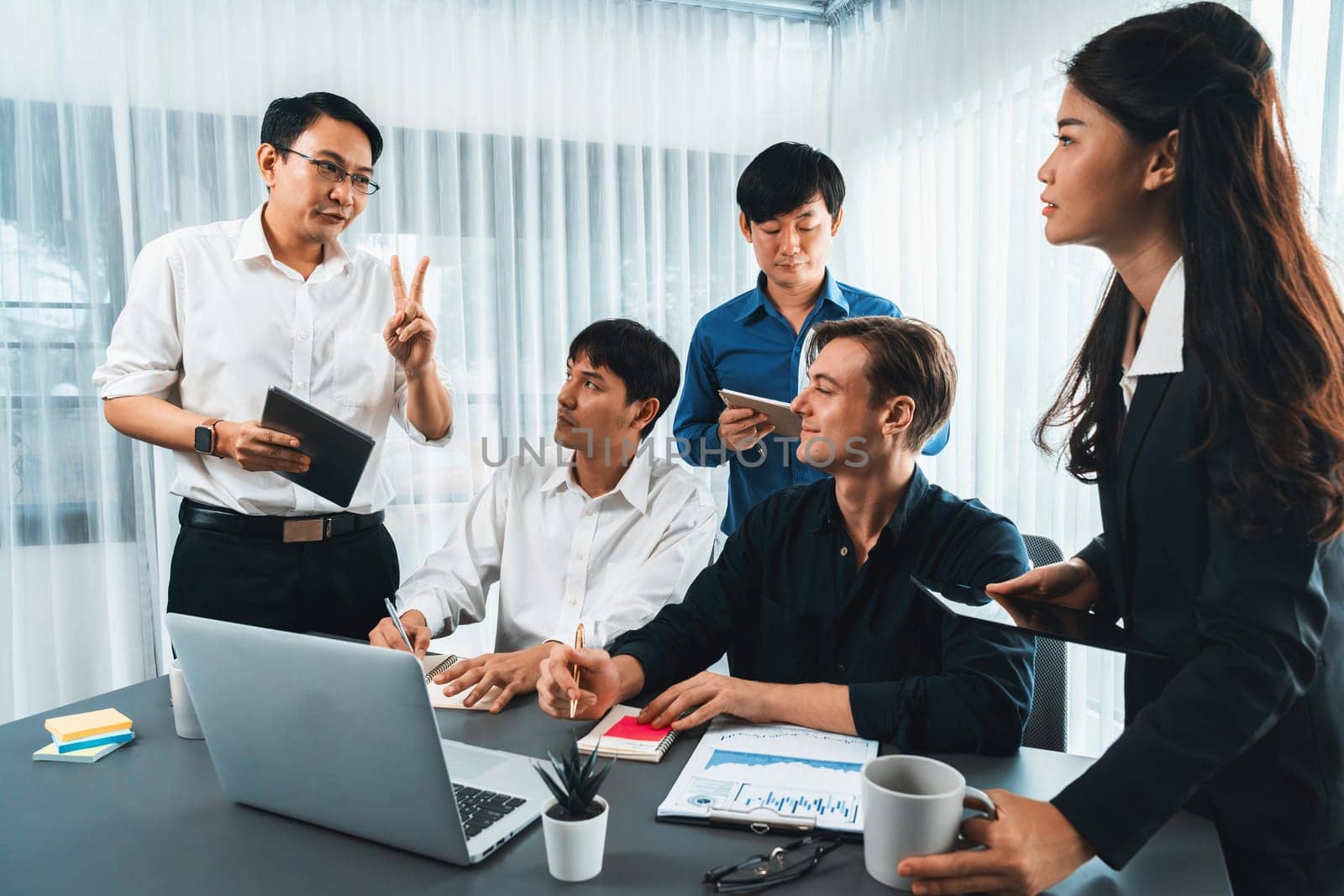 Group of diverse office worker employee working together on strategic business marketing planning in corporate office room. Positive teamwork in business workplace concept. Prudent