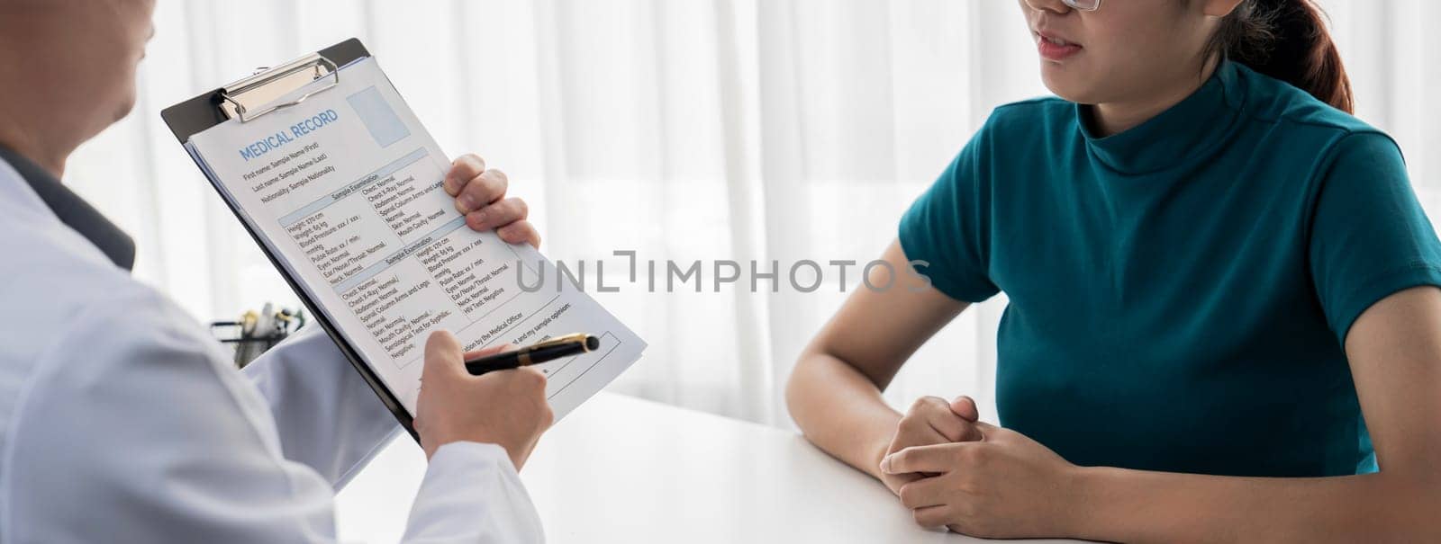 Patient attend doctor's appointment at clinic or hospital office, discussing medical treatment options and explaining examination results or medical record about sickness. Panorama Rigid