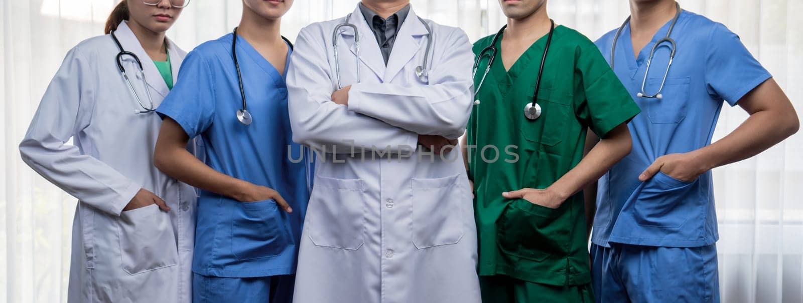 Confident and professional team of medical staff stand in line together. Rigid by biancoblue