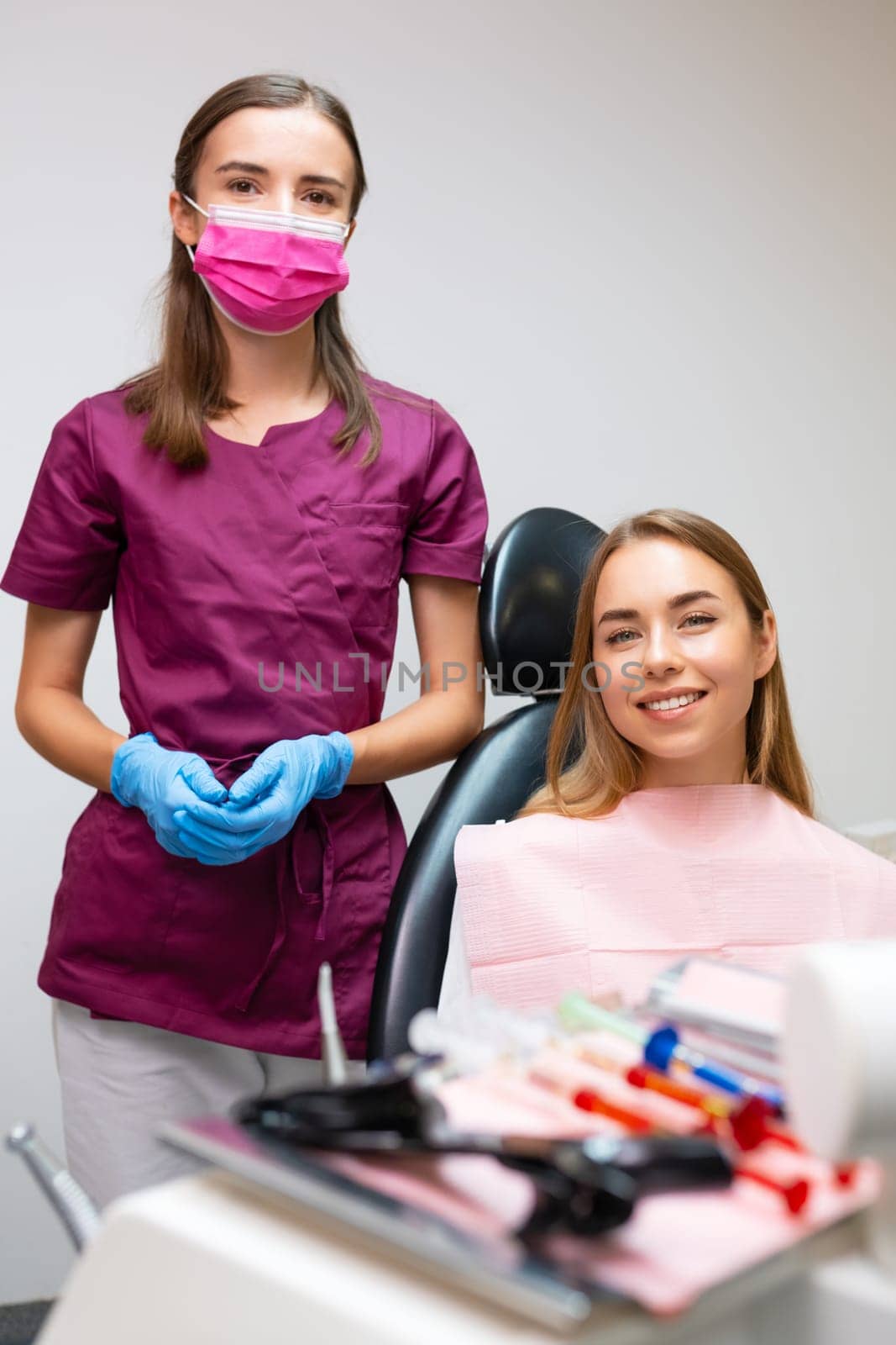 Portrait of dentist and patient in dentist office.