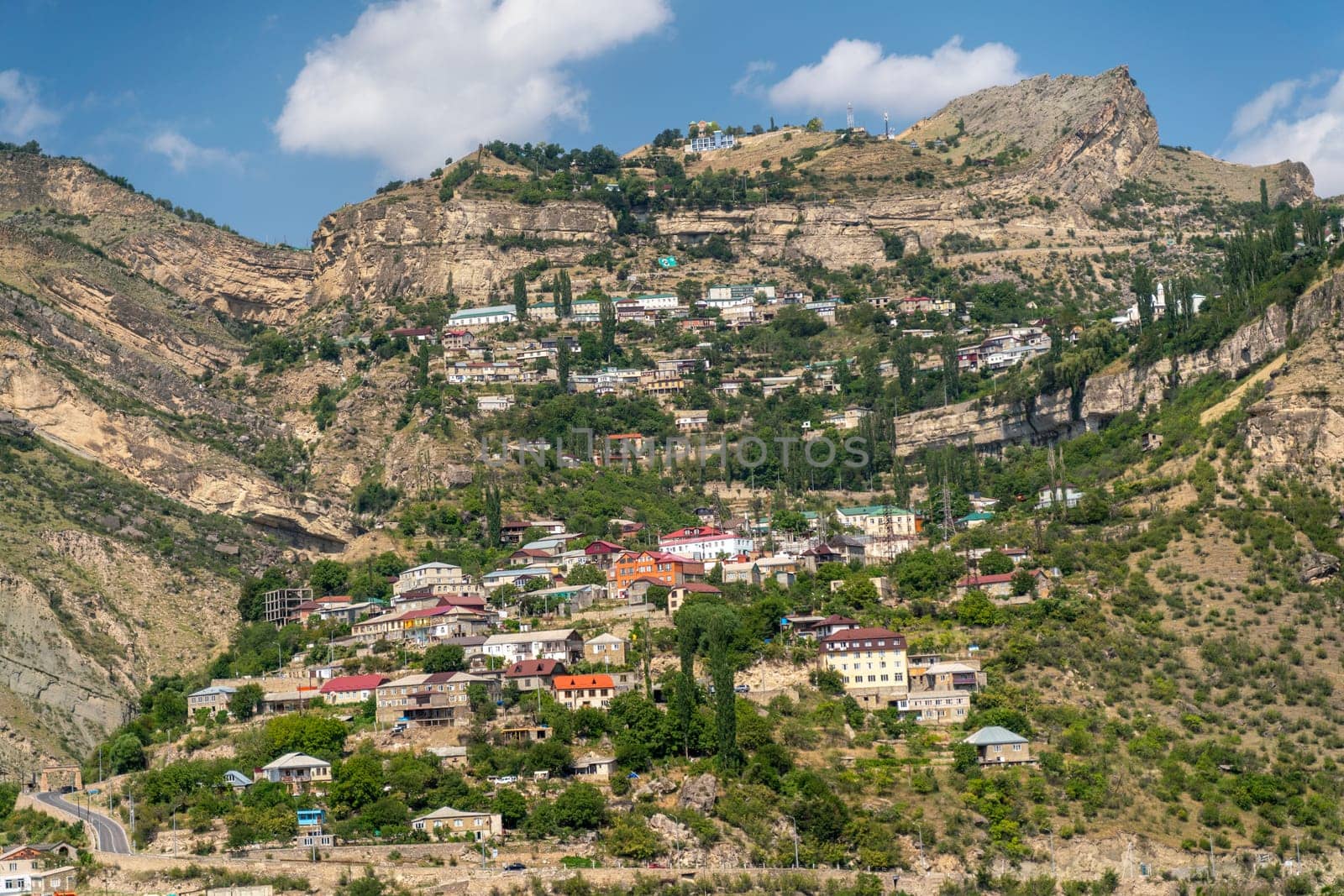 Village of Goor in Dagestan. Facades of houses located in tiers on a steep slope, summer landscape