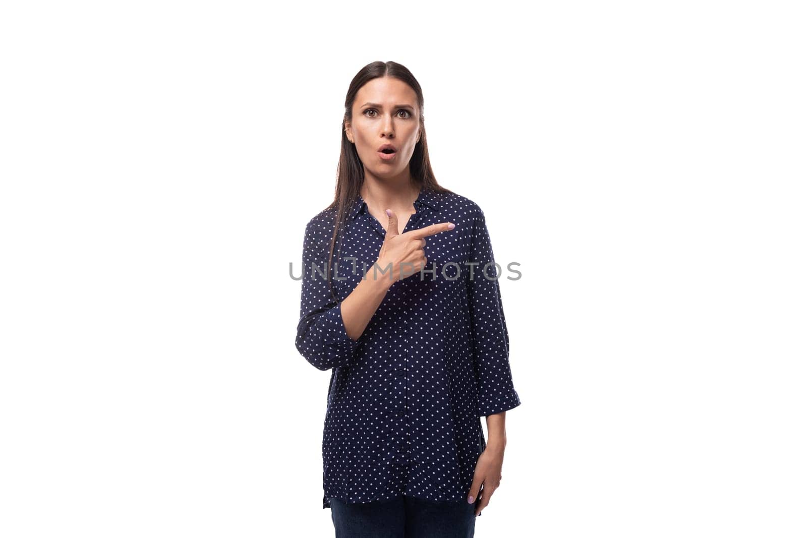 young adorable slim brunette woman dressed in blue polka dot shirt.