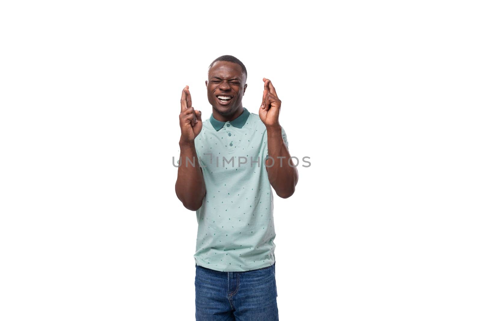 young slender american man dressed in a t-shirt smiles cutely on a white background by TRMK