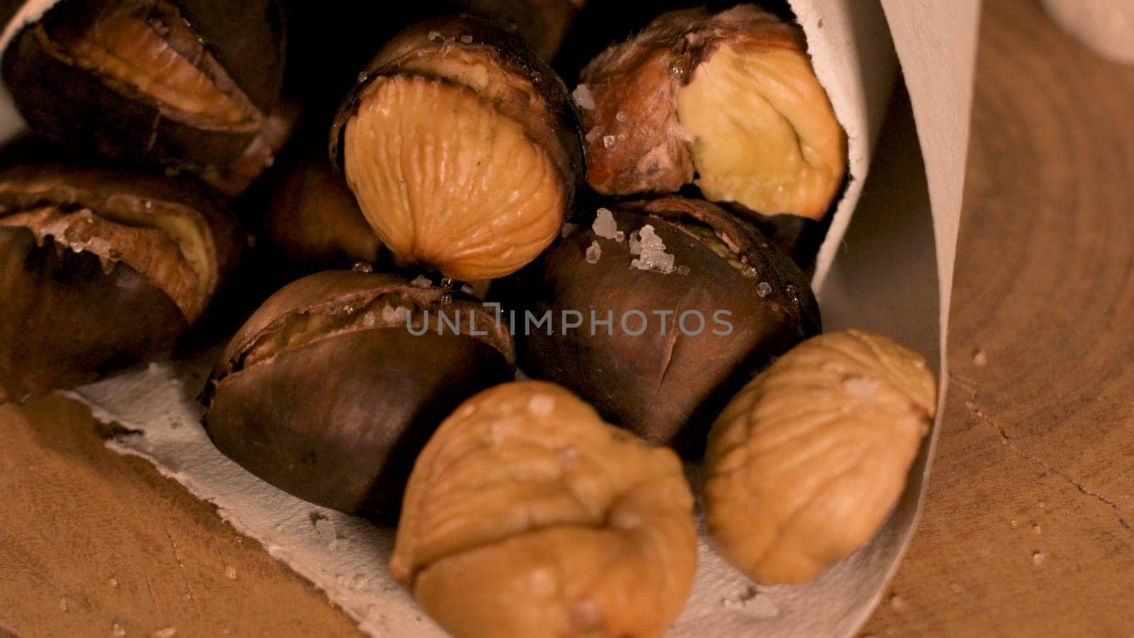 Roasted chestnuts in a paper cone by homydesign