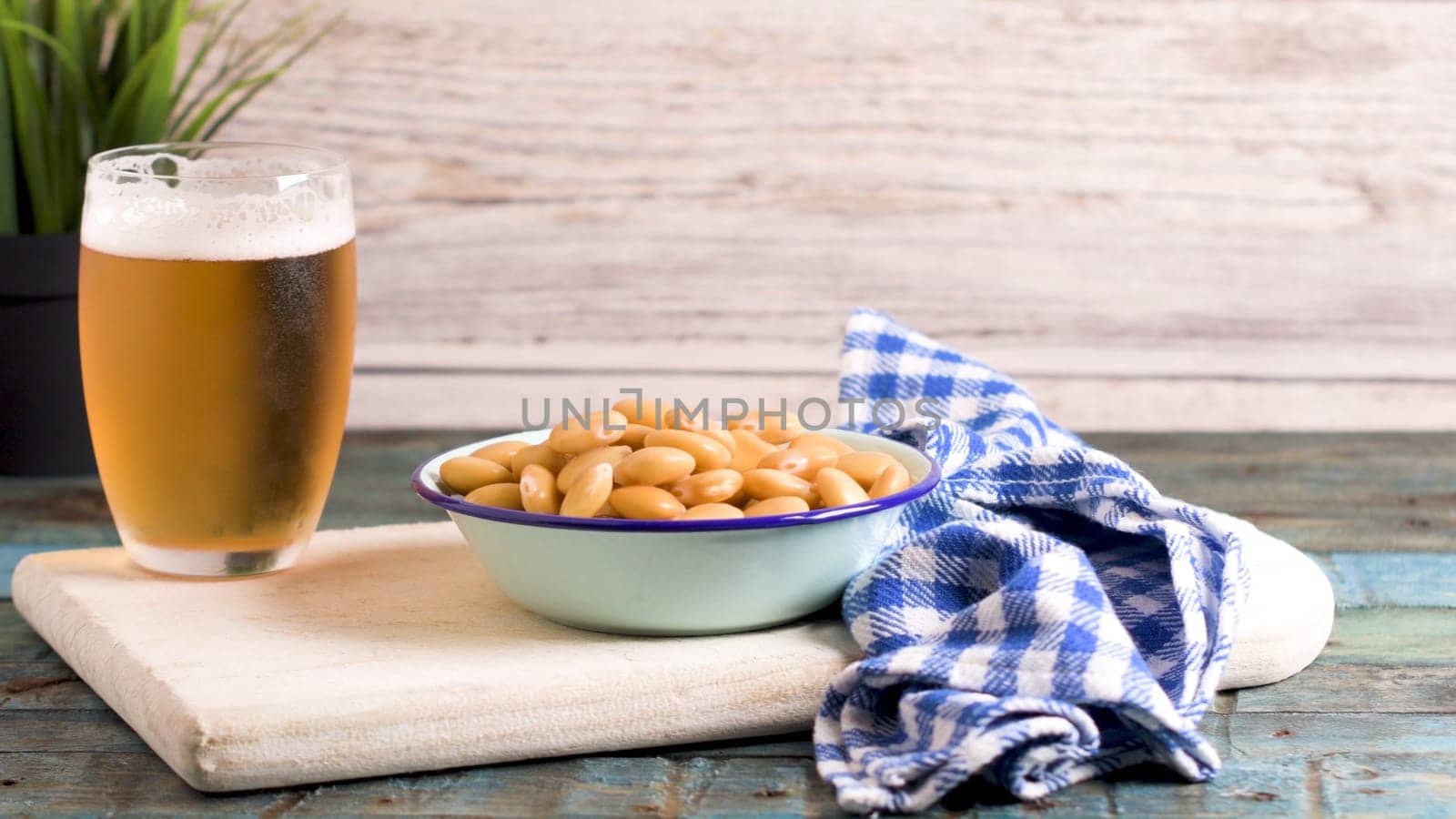 Tasty lupins and glass of beer by homydesign